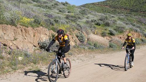 Two people cycling on a trail at Diamond Valley Lake